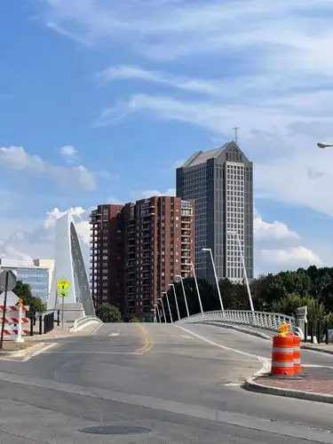 Modern lines and city views under a boundless blue sky.